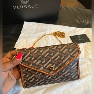 New condition Versace la Greca small crossbody bag with zero flaws.